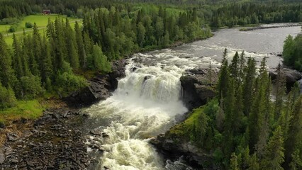 Wall Mural - Ristafallet waterfall in the western part of Jamtland is listed as one of the most beautiful waterfalls in Sweden.