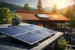 Photovoltaic panels on the roof of a small modern house. Green energy and energy saving concept. Roof with solar panels. View of solar panels in the roof house with sunlight.