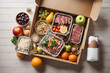 Delivery of ready made healthy food at home. Various dishes, meat cuts, fruits and vegetables in containers in a box, top view