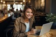 Woman with a laptop. The concept of remote work or freelancing. Portrait with selective focus