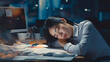 Exhausted young Asian business woman sleeping on her office desk next to computer and documents. Company worker tired of overworking. Female employee workaholic suffering from chronic fatigue at