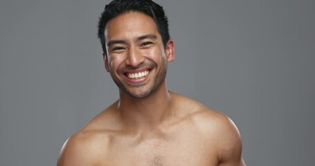 Sticker - Happy asian man, deodorant and armpit for grooming, hygiene or fresh smell against a grey studio background. Portrait of male person smile for cleaning, cosmetics or skincare product on mockup space