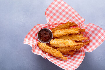 Wall Mural - Cooked tempura shrimp in a basket with dipping sauce