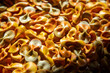 fall-colored striped bowtie pasta background, dramatic lighting