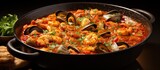 Spanish stew with fish fillets sea mollusks and crustaceans in a thick sauce