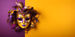 Colorful traditional venetian or mardi gras carnival mask with decoration for national festival celebration on purple - yellow background with copy space.