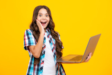 Sticker - Amazed teen girl. School student using laptop. E-learning and online education. Teen girl on internet video chat isolated on isoalted studio background. Excited expression, cheerful and glad.