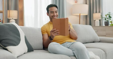 Aufkleber - Man, sofa and tablet for home video streaming, social media and relax with internet connection in living room. Young asian person on digital technology for website information, subscription and couch