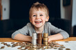 Happy cute little boy stacking coins at home, smiling child collecting money home financial concept