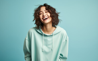 happy fashion smiling girl with bright clothing in solid light background