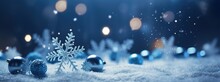 Winter Snowy Background With Christmas Toys, Snowdrifts, Beautiful Light And Snow Flakes On The Blue Sky In The Evening, Banner Format, Copy Space. Christmas Decoration