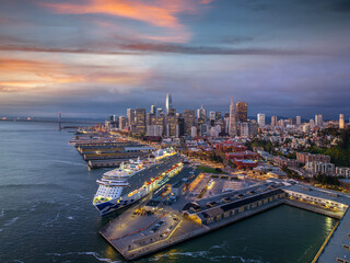 Poster - Cityscape view of San Francisco and the Bay Bridge with Colorful Sunset from island