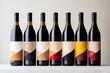 Set of bottles of wine with abstract labels in row