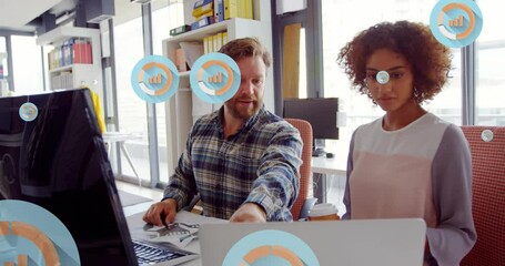 Poster - Animation of multiple graph icons over diverse coworkers discussing on desk in office