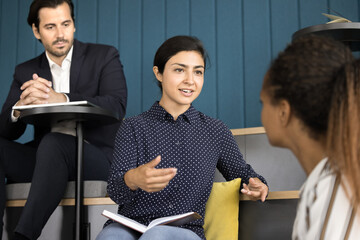 Poster - Diverse business colleagues talking on meeting in office presentation room, classroom, discussing corporate training, brainstorming on project ideas. Indian professional woman speaking to coworker