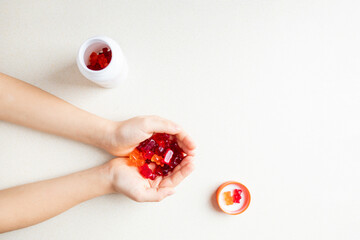 Vitamins and supplements gummy bears  on a white background. Top view, flat lay. 