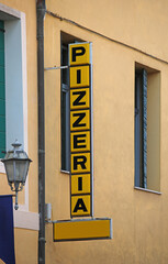 Wall Mural - text of the sign with the text pizzeria which in Italian is the place where pizzas are served