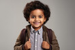 Cute indian little boy in suit, smiling on white background.