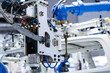 © THINK b - robot arm working in factory