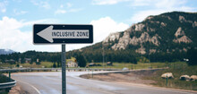 Inclusive Zone Blue Arrow Road Sign On Mountain Background