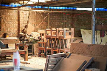 A busy and messy furniture processing factory