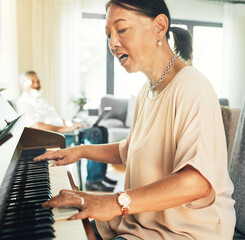 Canvas Print - Singing, piano and senior woman playing for music with husband in living room for bonding and entertainment. Instrument, practice and elderly Asian man and woman in retirement with keyboard at home.