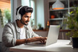 © Niks Ads - Young man using laptop and headphones