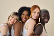 © insta_photos - Happy multicultural girls in underwear hugging on beige background, portrait. Smiling positive diverse women, four beauty faces models girls group in underwear bras hugging advertising skin body care.