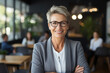 © Michael - Portrait of smiling middle aged businesswoman
