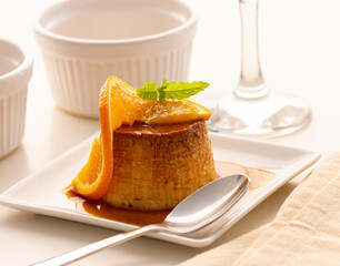 Homemade orange flan in one, a delicious dessert. Studio photography.