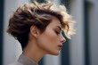Young female model showing stylish short hairdo side view