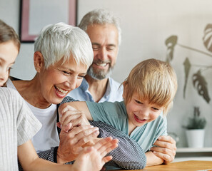 Wall Mural - grandchild family child grandparent grandfather happy together grandmother girl senior boy man woman