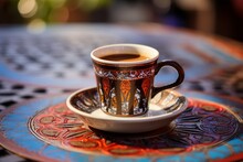 A Traditional Turkish Coffee Cup Filled With Rich, Dark Coffee, Resting On A Colorful Kilim Rug, With A Backdrop Of The Bustling Streets Of Istanbul