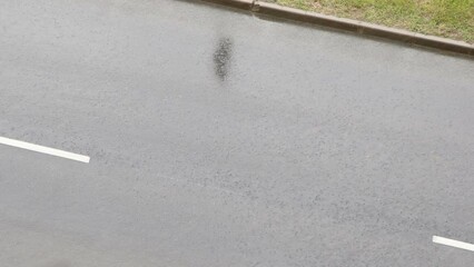 Heavy rain on asphalt road.
