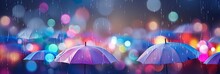 Blurred Out Rainy Abstract Background With Umbrellas And Lots Of Bokeh And Room For Text.