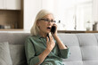 © fizkes - Shocked surprised blonde senior woman excited with telephone call talking on cellphone, speaking emotionally, listening with open mouth, getting awesome news from conversation