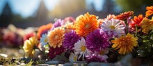 Christian Autumn Event With Colorful Chrysanthemums Decorating Tombstones In Cemetery With Copyspace For Text