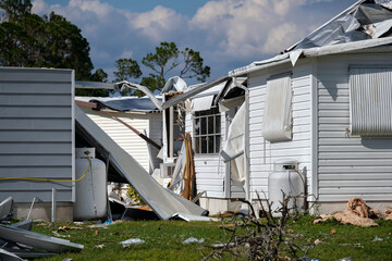 Poster - Severely damaged houses after hurricane Ian in Florida mobile home residential area. Consequences of natural disaster