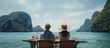 An Asian couple enjoys their honeymoon on a boat in Thailand relaxing eating seafood and exploring Koh Phi Phi island Maya beach and Phang Nga near Phuket With copyspace for text