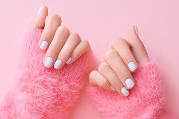 Poster - Close up womans hands with white manicure