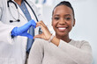 © D Theron/peopleimages.com - Black woman, patient and doctor with smile, consultation and heart emoji for cardio health, checkup and appointment. Happiness, support and wellness for medicine, healthcare and physical examination