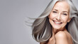 Gorgeous aging mature woman with long gray hair and happy smiling Beautiful woman with smooth healthy face skin. 