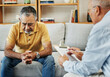 © aLListar/peopleimages.com - Senior man talking to a therapist at a mental health, psychology and therapy clinic for session. Psychologist with clipboard for counseling checklist with elderly male patient in retirement in office