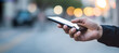 © ZAY WIN HTAI - Businessman using his smartphone in city
