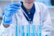 © Supapich - Professional scientist chemist technician analysis research experiment virus blue liquid pipette glass test tube equipment in hospital laboratory, woman doctor white lab coat medical research develop