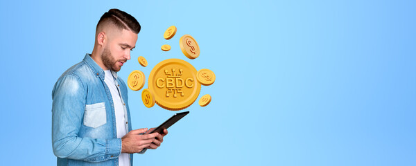 Poster - Man looking at tablet in hands, CBDC with gold dollar coins on copy space