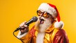 © volga - A joyful man sings into a microphone in a Santa Claus costume on a yellow background. New Year and Christmas concert.