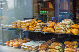 Fototapeta Boho - Close-up view of store window with bakery products. Sweden.