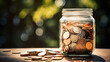 Coins in a glass jar on blurred background. Saving concept.