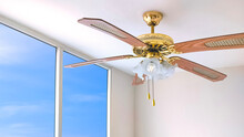 Vintage Ceiling Fan With Electric Lamps Hanging On Ceiling Inside Of White Room